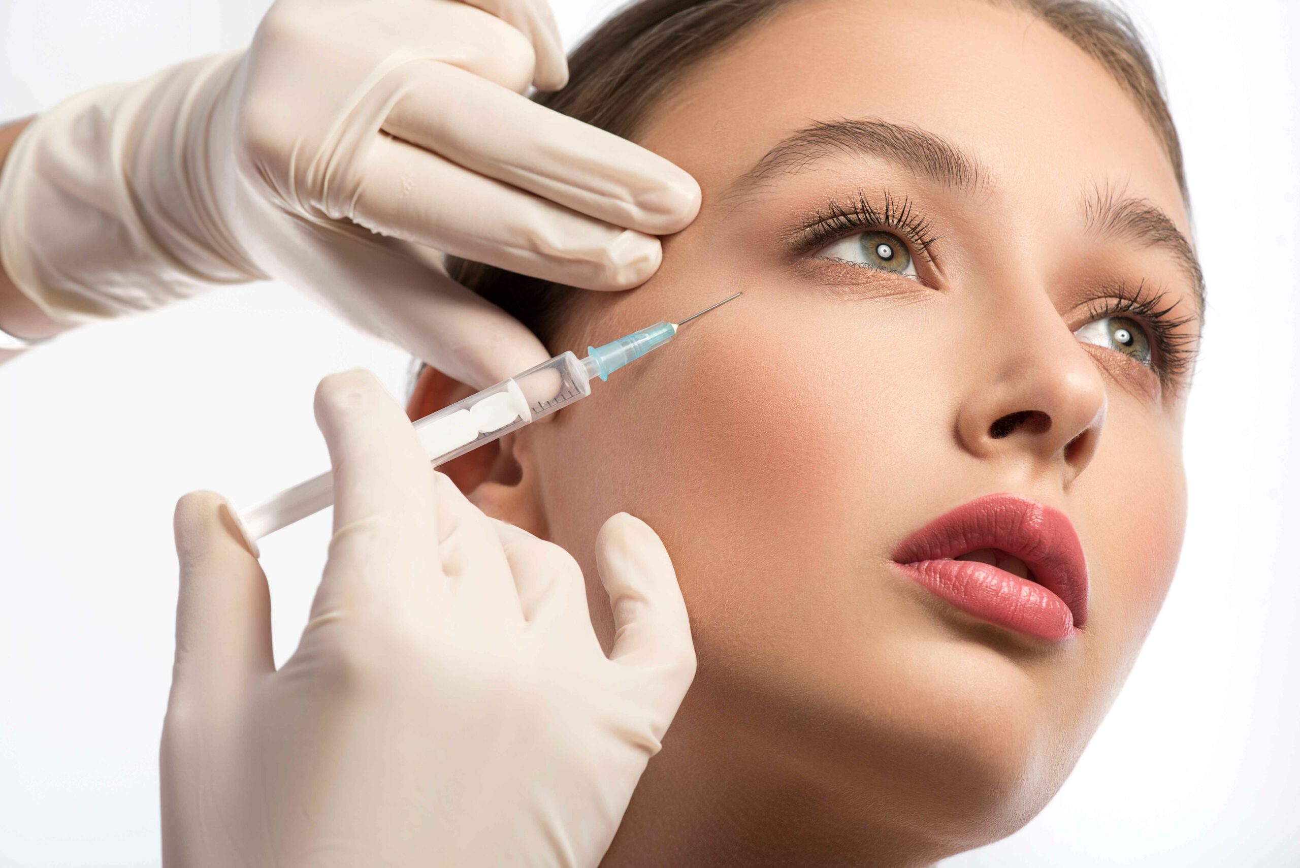 A Pretty Woman Getting Injection on near eyes | Botox | Jeuveau | Daxxify | Mirror Mirror Aesthetics and Wellness in Tucson, AZ