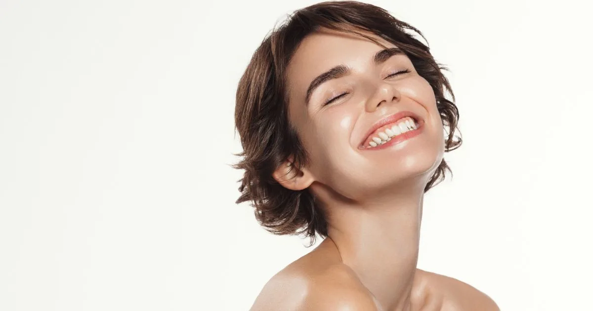 Woman with clear, radiant skin, representing the overall vitality, energy, and anti-aging results achieved through peptide therapy.